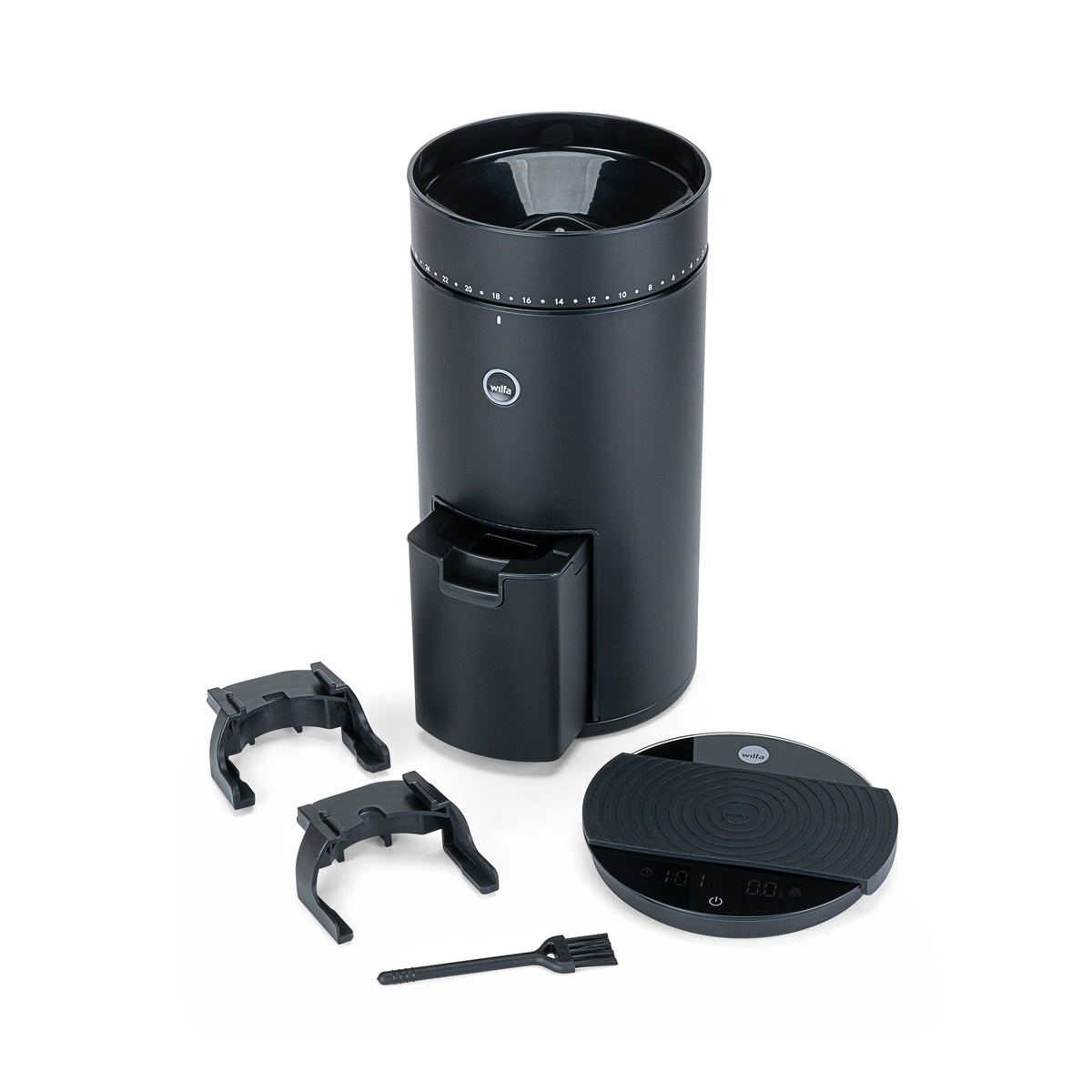 Wilfa Uniform Evo black coffee grinder with its accessories laid out: two portafilter forks, grounds container, lid and cleaning brush.