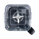 Top-down view into the Wilfa Powerfuel XL blender jar, showing the six-prong stainless steel blade and the black handle.