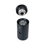 Wilfa Uniform Evo coffee grinder with the upper burr removed and held above the body, showing the stainless steel grinding burrs.
