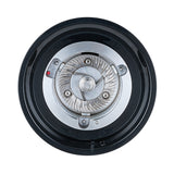 Top-down view into the Wilfa Uniform Evo coffee grinder with the hopper removed, showing the stainless steel burr.