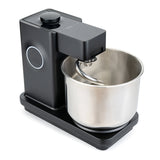Wilfa Probaker NXT black stand mixer seen at an angle, with the stainless steel bowl and dough hook in place.